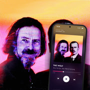 THE WOLF digital album: cover art with a phone playing it on meaningwave.com