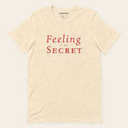 FEELING IS THE SECRET with Neville Goddard T-Shirt in Heather Natural, front