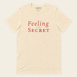 FEELING IS THE SECRET with Neville Goddard T-Shirt in Heather Natural, front