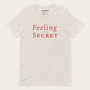 FEELING IS THE SECRET with Neville Goddard T-Shirt in Heather Dust, front